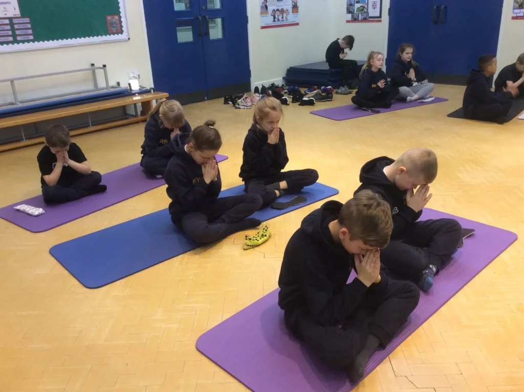 Yoga and mindfulness lesson delivered to pupils to support focus and emotional regulation in Atherton