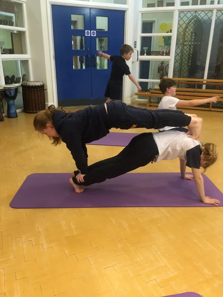 Education-based yoga workshop introducing pupils to mindfulness, posture and breathing techniques in Bolton