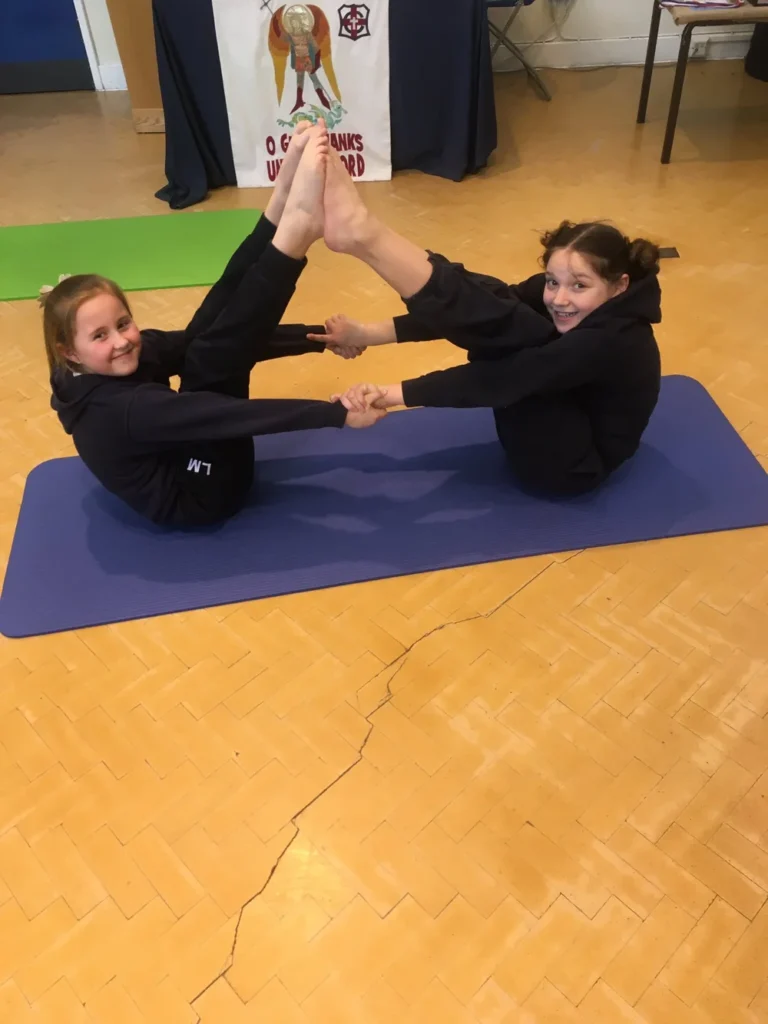 Classroom yoga session helping young people practise relaxation, grounding and self-awareness in Atherton schools
